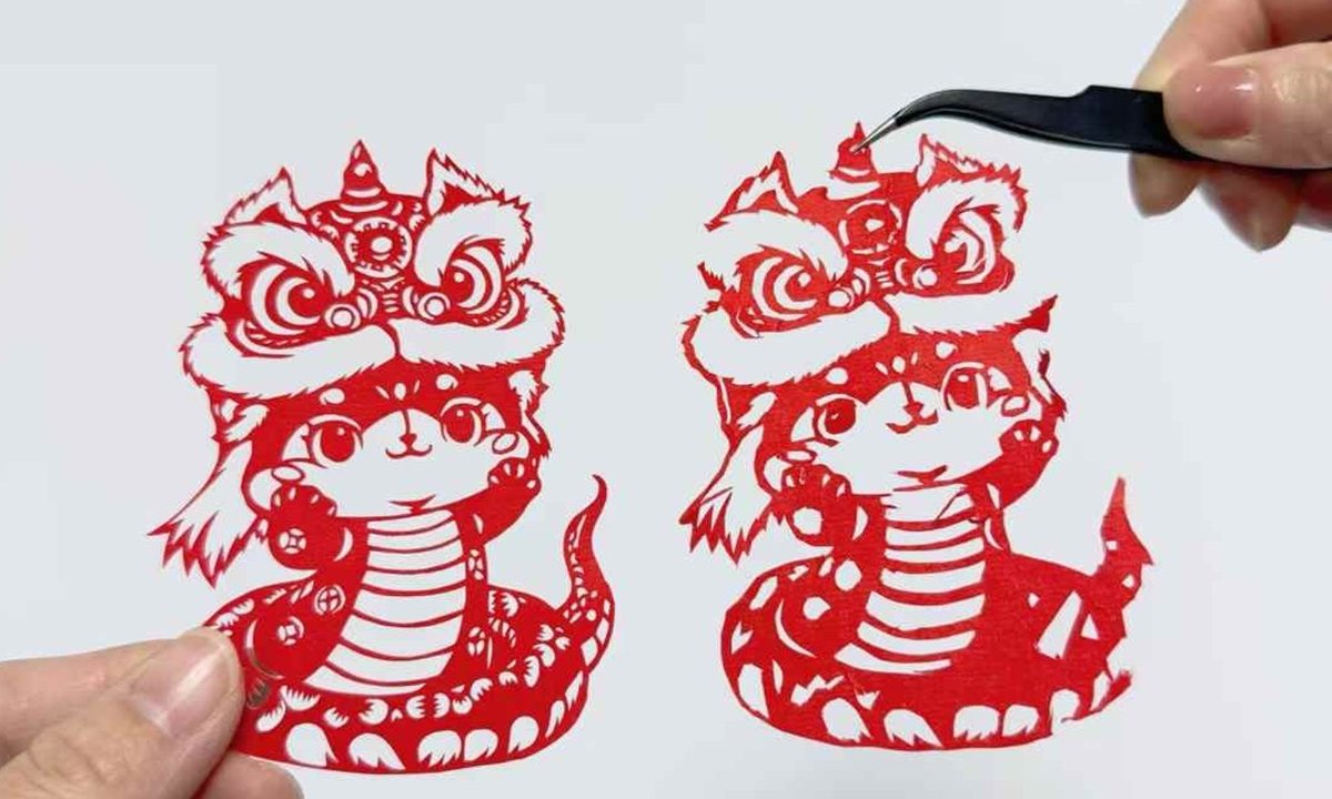 Liu Jie, an independent artisan from Hunan Province, has just completed a pair of Snake Year-themed Spring Festival paper-cuttings, highlighting the artistry of intangible cultural heritage paper-cutting. Photo: Chen Qingrui/GT