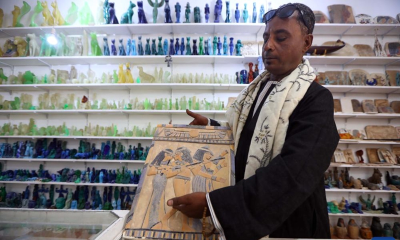 A seller shows an alabaster artwork at a store in Luxor, Egypt, on Jan. 10, 2025. Amidst the ancient temples and tombs in Egypt's Luxor, skilled artisans continue to transform alabaster -- a luminous stone once cherished by pharaohs -- into breathtaking artworks, reviving the legacy of their ancestors. (Xinhua/Ahmed Gomaa)