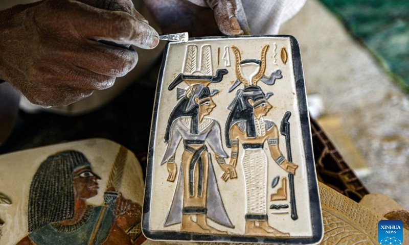 An artisan works on an alabaster artwork at a workshop in Luxor, Egypt, on Jan. 10, 2025. Amidst the ancient temples and tombs in Egypt's Luxor, skilled artisans continue to transform alabaster -- a luminous stone once cherished by pharaohs -- into breathtaking artworks, reviving the legacy of their ancestors. (Xinhua/Ahmed Gomaa)