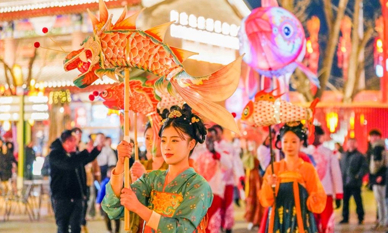 A performance is staged at the Hetou ancient street scenic area in Tangshan, north China's Hebei Province, Jan. 26, 2025. China is alive with vibrant celebrations with the Spring Festival just around the corner. (Photo by Liu Mancang/Xinhua)