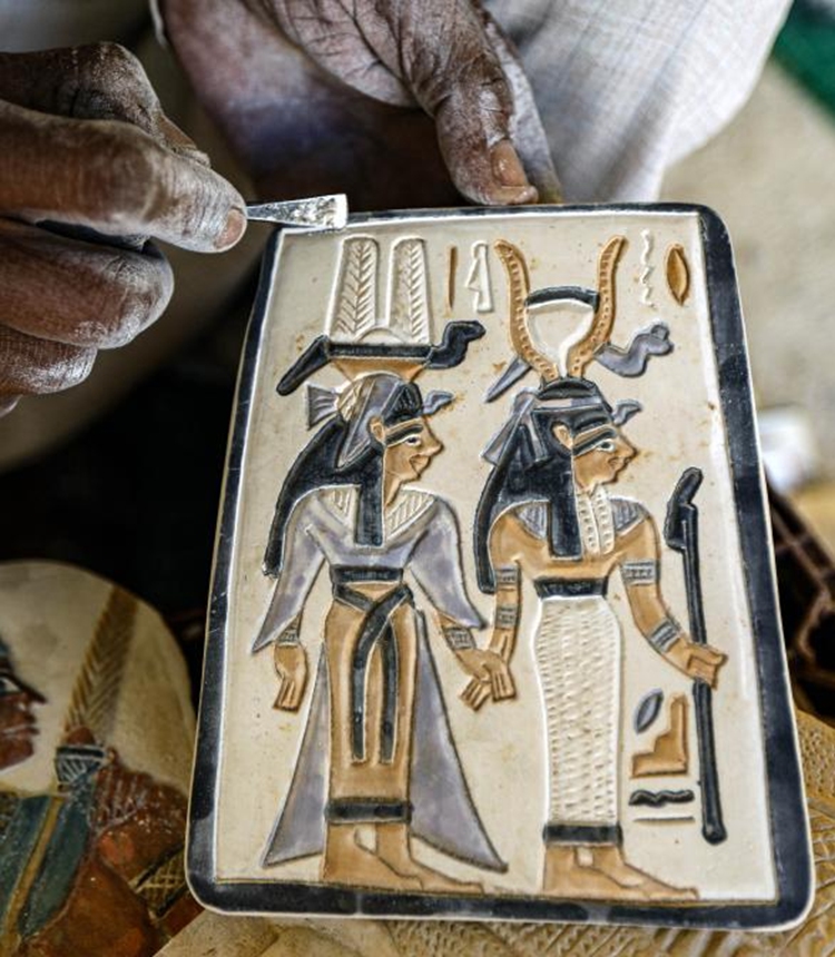 An artisan works on an alabaster artwork at a workshop in Luxor, Egypt, on Jan. 10, 2025. Amidst the ancient temples and tombs in Egypt's Luxor, skilled artisans continue to transform alabaster -- a luminous stone once cherished by pharaohs -- into breathtaking artworks, reviving the legacy of their ancestors. (Xinhua/Ahmed Gomaa)