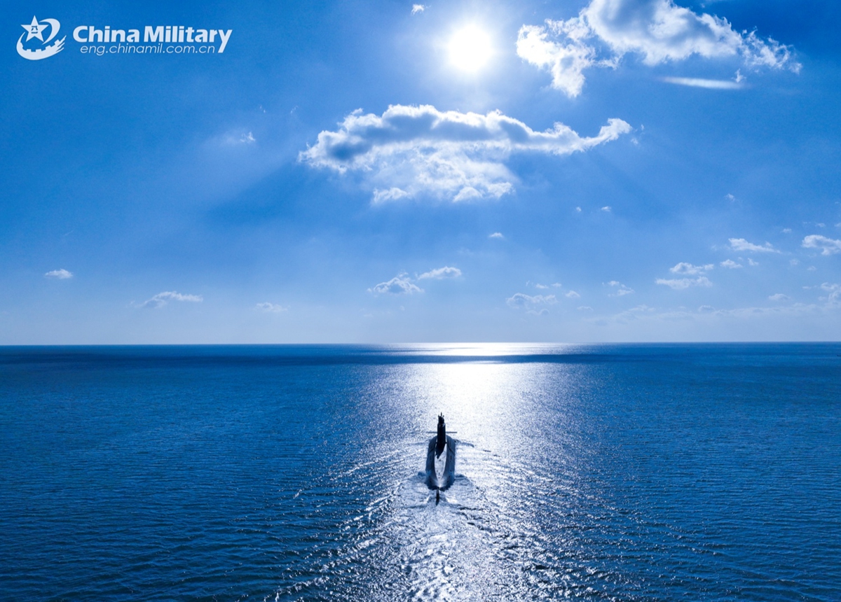 A submarine attached to a naval submarine flotilla under the Chinese PLA Northern Theater Command sails in a surface position during a combat training exercise on January 6, 2025. (eng.chinamil.com.cn/Photo by Zhang Nan)