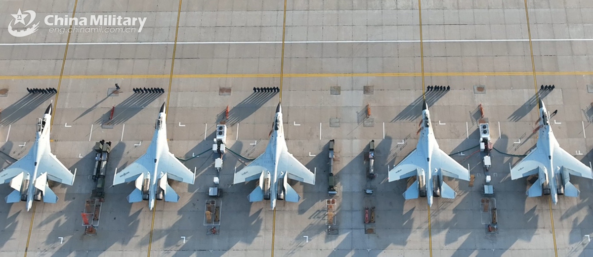 J-11BS fighter jets attached to the Chinese PLA Naval Aviation University receive pre-flight inspection prior to a force-on-force flight training exercise on January 4, 2025. (eng.chinamil.com.cn/Photo by Zhang Zhiguang)