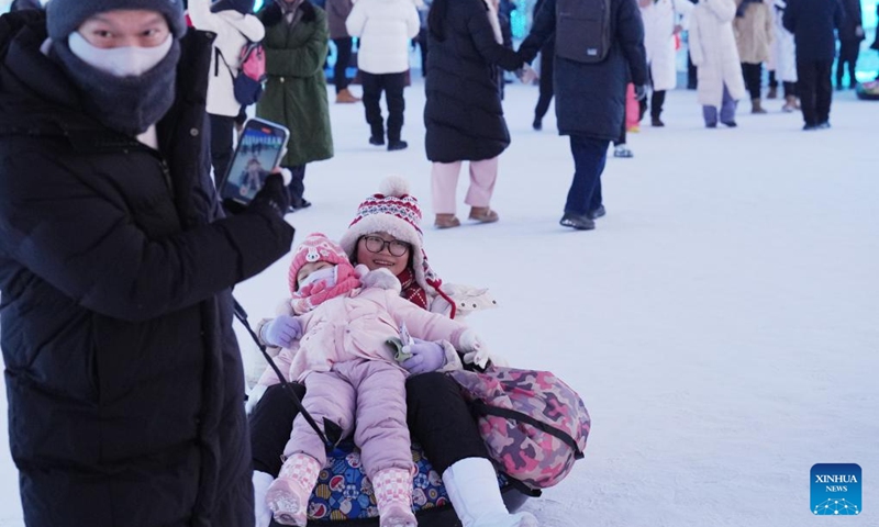 People play at the Harbin Ice-Snow World in Harbin, northeast China's Heilongjiang Province, Jan. 5, 2025. As the 9th Asian Winter Games (AWG) approaching, Harbin, known for its stunning ice sculptures and deep-rooted winter sports culture, is brimming with anticipation. As the city's iconic landmark, the Harbin Ice-Snow World, with this year's edition, the largest in its history, boasts 1 million square meters. The park shares its theme this year with the upcoming AWG to be held in Harbin: Dream of Winter, Love Among Asia. Harbin, which successfully hosted the 3rd AWG in 1996, is once again stepping onto the world stage. The whole city is under an upgrade to provide better services for winter sports lovers and tourists. Photo: Xinhua