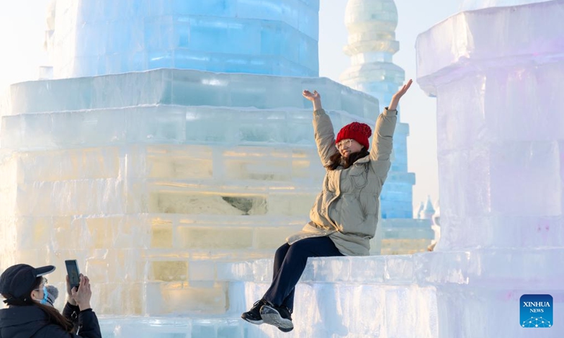 People take photos at the Harbin Ice-Snow World in Harbin, northeast China's Heilongjiang Province, Jan. 23, 2025. As the 9th Asian Winter Games (AWG) approaching, Harbin, known for its stunning ice sculptures and deep-rooted winter sports culture, is brimming with anticipation. As the city's iconic landmark, the Harbin Ice-Snow World, with this year's edition, the largest in its history, boasts 1 million square meters. The park shares its theme this year with the upcoming AWG to be held in Harbin: Dream of Winter, Love Among Asia. Harbin, which successfully hosted the 3rd AWG in 1996, is once again stepping onto the world stage. The whole city is under an upgrade to provide better services for winter sports lovers and tourists. Photo: Xinhua