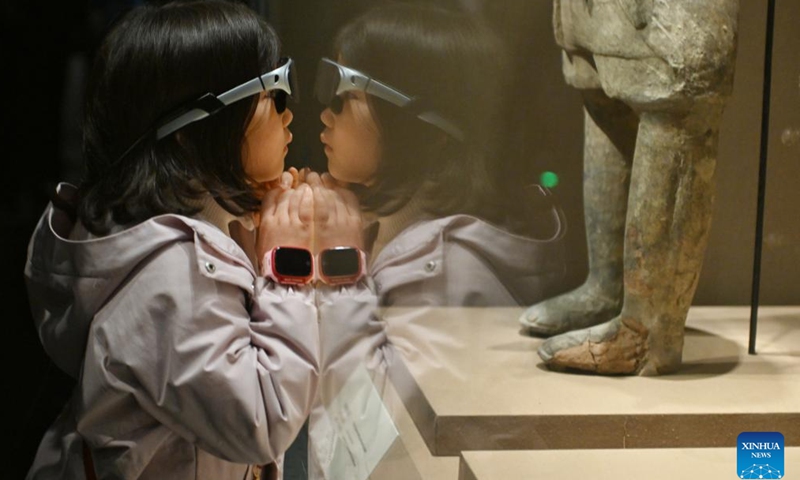 A child using augmented reality (AR) glasses visits the Chengdu Museum during the Spring Festival holiday in Chengdu, southwest China's Sichuan Province, Feb. 3, 2025. (Xinhua/Liu Kun)