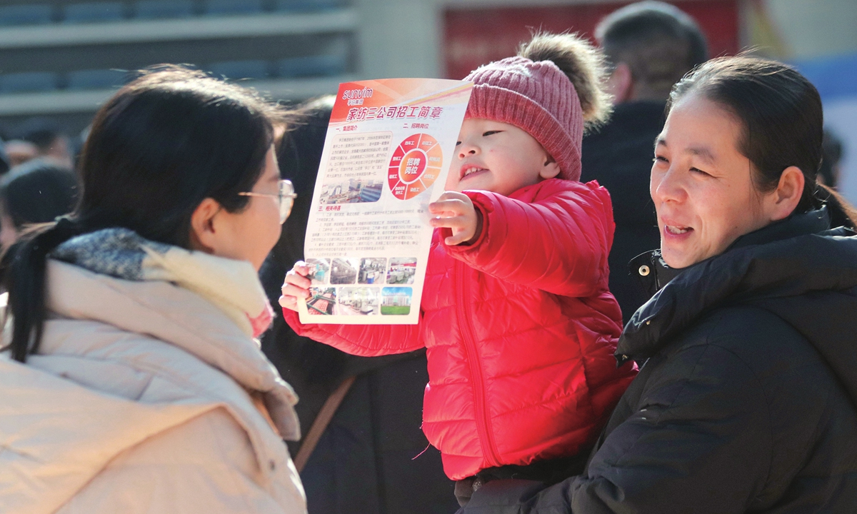 Job seekers learn about vacancies at a job fair held during the Chinese Spring Festival in Gaomi, East China's Shandong Province, on February 4, 2025. Multiple Chinese localities have been holding recruitment events amid the long holiday as people return to big cities from their hometowns. Photo: VCG