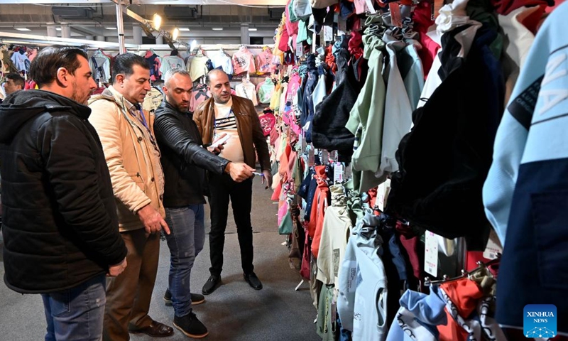 People attend the Khan al-Harir Exhibition for clothing, textiles, and weaving machinery in Damascus, Syria, on Feb. 6, 2025. (Photo by Ammar Safarjalani/Xinhua)