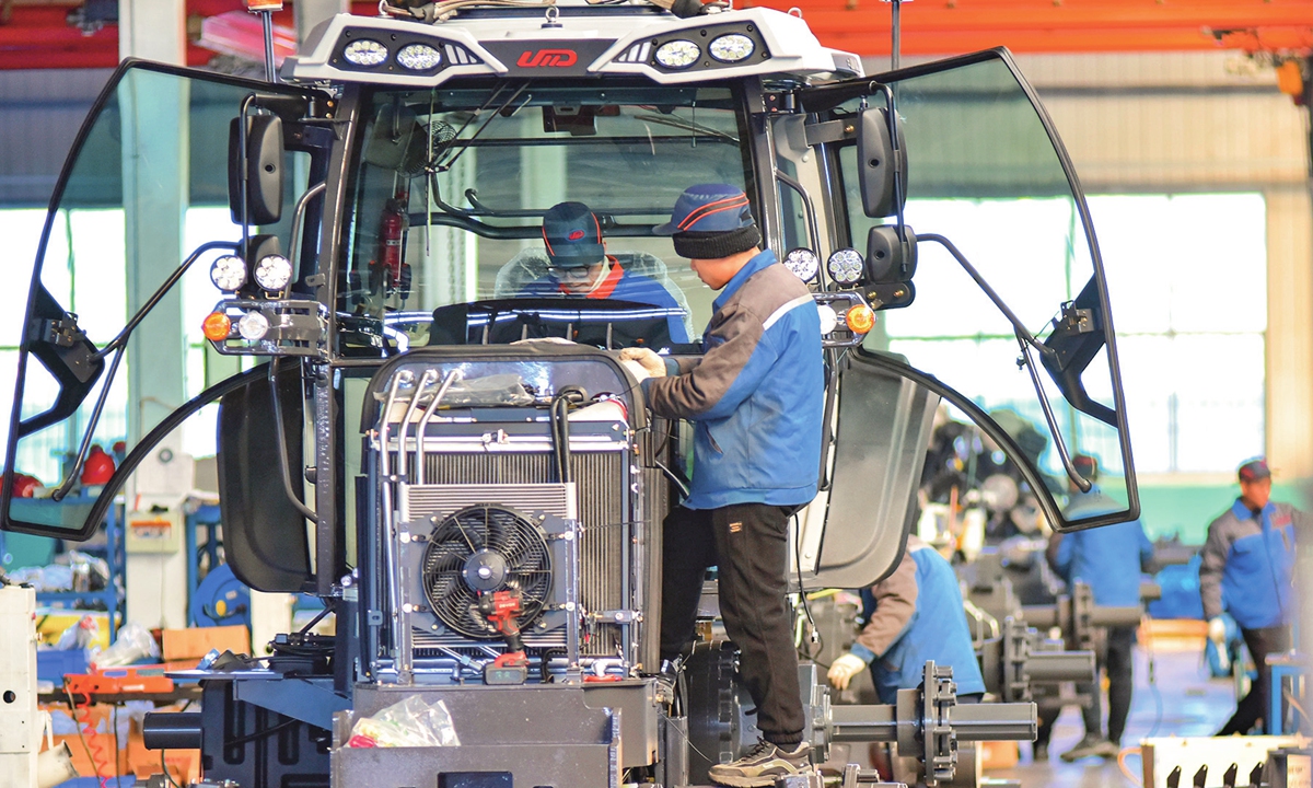 Employees work at a tractor factory in Weifang, East China's Shandong Province on February 9, 2025. Following the conclusion of the Spring Festival holidays, spring ploughing preparations are underway across China, with fertilizer production running at full capacity to support spring planting and agricultural production for the year ahead. Photo: VCG
