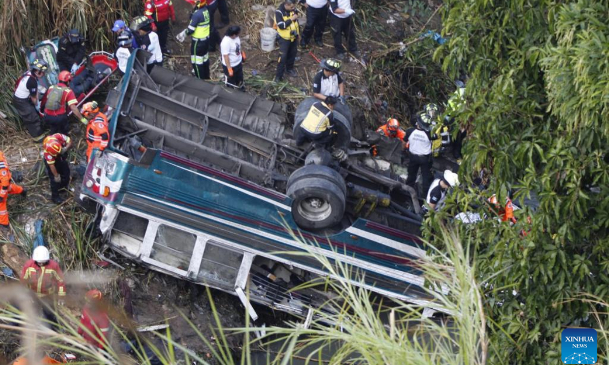 Rescuers work at the site of a bus accident in Guatemala City, Guatemala, on Feb. 10, 2025. At least 51 people were killed after a bus carrying 75 people plunged into a ravine in Guatemala City on Monday, the firefighters' spokesperson confirmed. (Str/Xinhua)