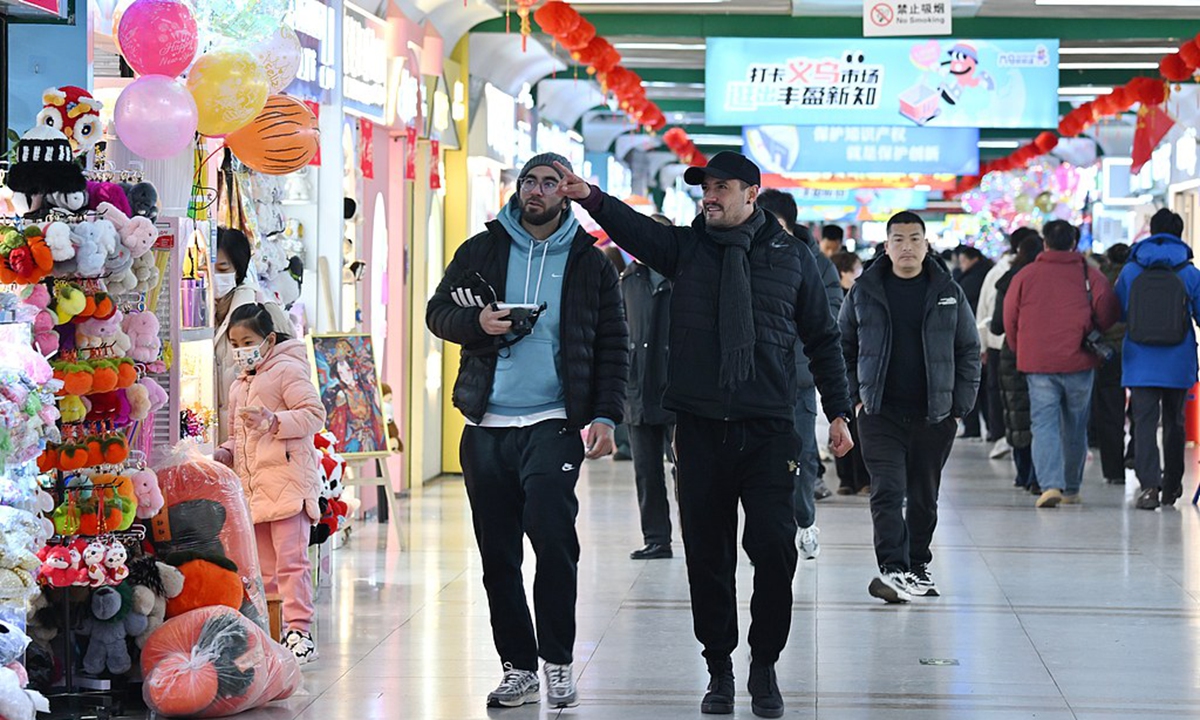 Foreign merchants browse commodities at a trade market in Yiwu, East China's Zhejiang Province on February 9, 2025. Photo: VCG