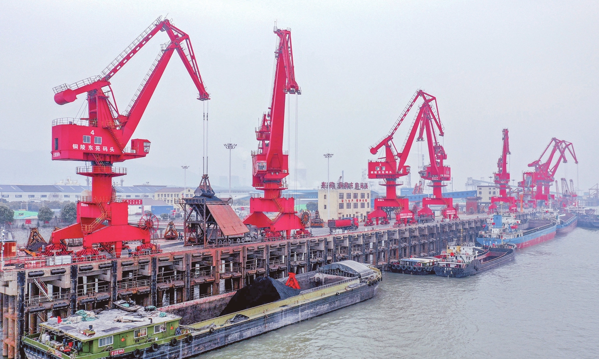 Cargo is loaded and unloaded at a terminal of the Tongling port in East China's Anhui Province on February 12, 2025. In January, the port completed throughput of 8.87 million tons, of which 74,200 tons involved foreign trade, up 55.03 percent year-on-year, achieving a good start for this year. Photo: VCG