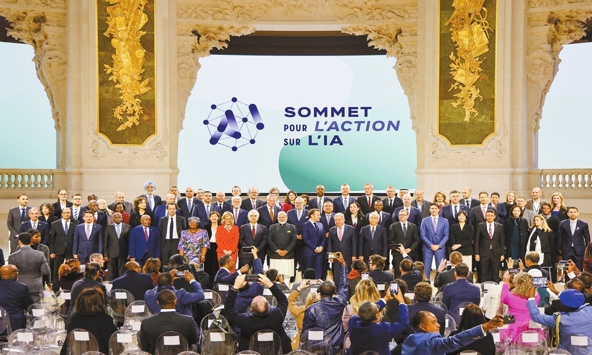 French President Emmanuel Macron (front C) poses for a group picture with world leaders and attendees at the end of the plenary session of the Artificial Intelligence (AI) Action Summit, at the Grand Palais, in Paris, on February 11, 2025. Photo: AFP