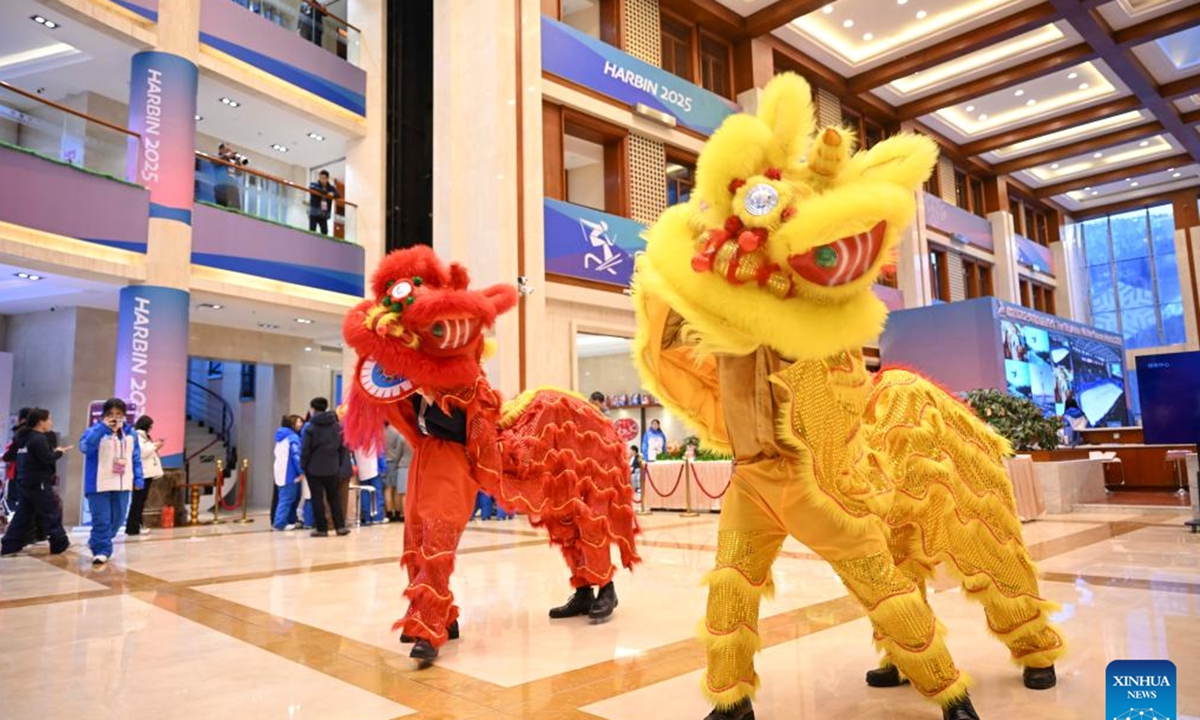 Performers demonstrate lion dance at an activity to celebrate the Lantern Festival at press center for the 9th Asian Winter Games in Yabuli, northeast China's Heilongjiang Province, Feb. 12, 2025. (Xinhua/Hu Huhu)