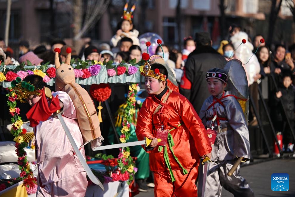 People perform during a memorial ceremony for Chinese sea goddess Mazu in north China's Tianjin Municipality, Feb. 13, 2025. Gegu Baonianhui, a memorial ceremony for Chinese sea goddess Mazu observed in Gegu Township, was staged on Thursday in Tianjin. This memorial ceremony was included in national intangible cultural heritage list in 2014. It is an important activity for the locals to celebrate the Chinese New Year and pray for good luck. (Photo: Xinhua)