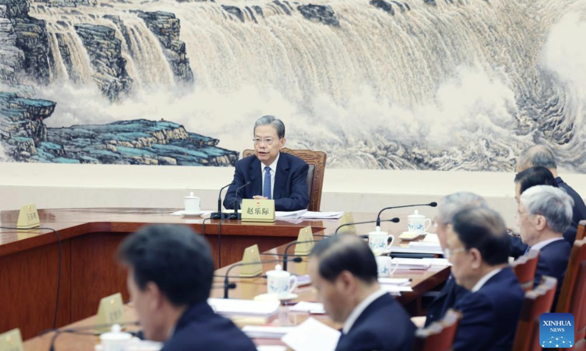 Zhao Leji, chairman of the National People's Congress (NPC) Standing Committee, presides over the 38th meeting of the Council of Chairpersons of the 14th NPC Standing Committee at the Great Hall of the People in Beijing, capital of China, Feb. 17, 2025. (Xinhua/Yao Dawei)