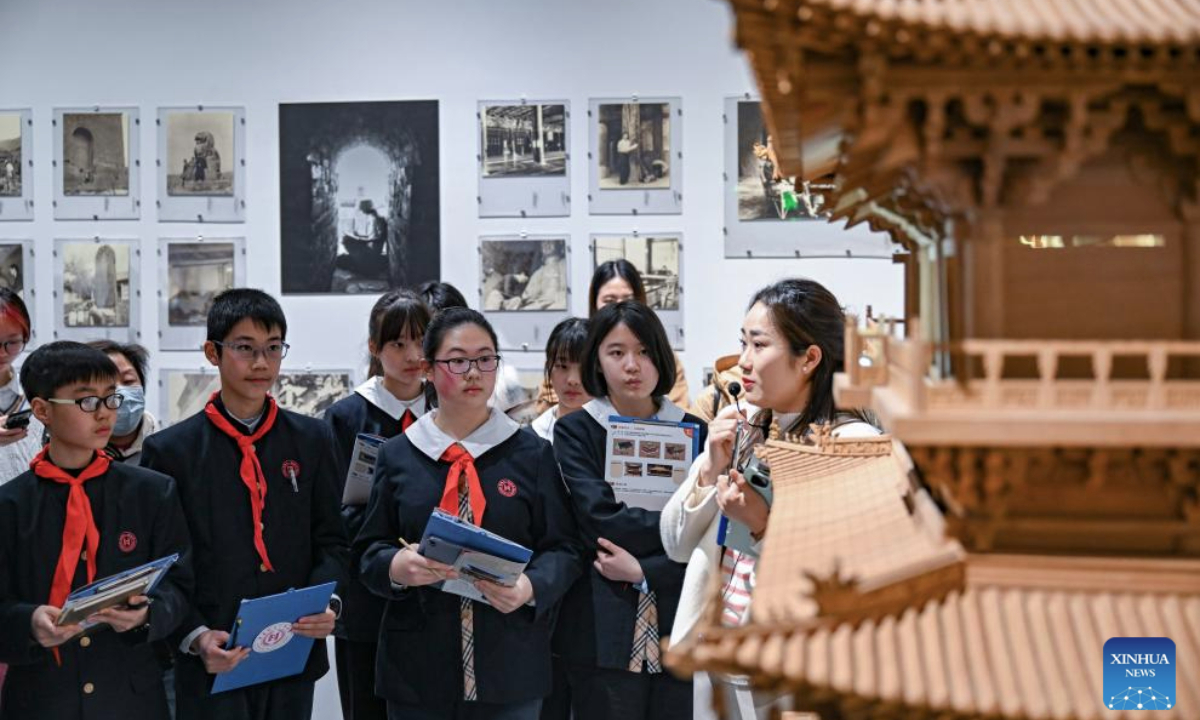Middle school students learn about Chinese ancient architecture at an art museum in Shanghai, east China, Feb. 17, 2025. With a mixture of nerves and excitement, many students in China attended their special first class of new semester. (Photo by Chen Haoming/Xinhua)
