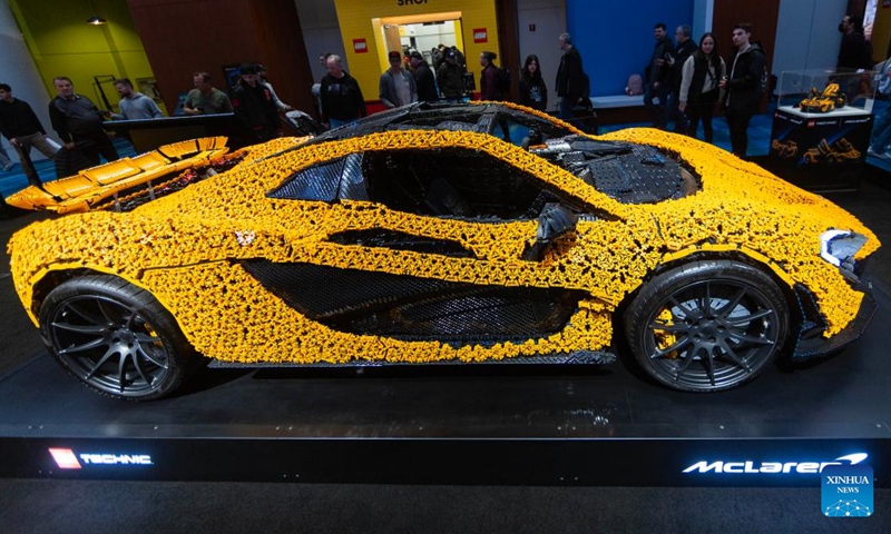 People view a life-size LEGO Technic McLaren P1 supercar (L) at the 2025 Canadian International AutoShow in Toronto, Canada, Feb. 18, 2025. Consisting of 342,817 LEGO Technic elements, a life-size model of McLaren P1 supercar is on display at the annual 10-day show starting from Feb. 14. (Photo: Xinhua)