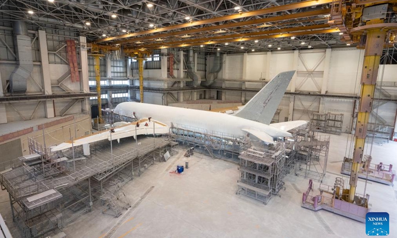 Staff members remove the original paint of an inbound airplane at a one-stop aircraft maintenance base of Hainan Free Trade Port in Haikou, south China's Hainan Province, Feb. 17, 2025. Since the one-stop aircraft maintenance base of Hainan Free Trade Port was put into use in 2022, a total of 83 aircraft and 17 engines have been maintained and repaired in the bonded zone, with a total value of 45.05 billion yuan (about 6.2 billion U.S. dollars). (Photo: Xinhua)