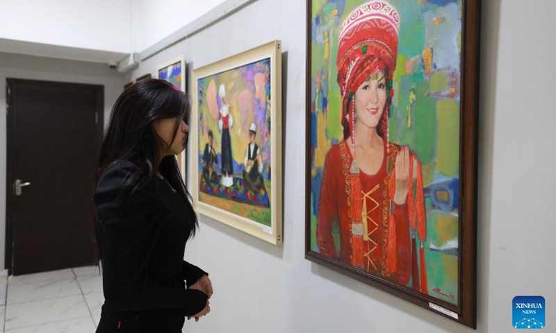 A woman visits an exhibition of paintings and sculptures about the Silk Road in Bishkek, Kyrgyzstan, on Feb. 18, 2025. The exhibition features more than 60 artworks. (Photo: Xinhua)