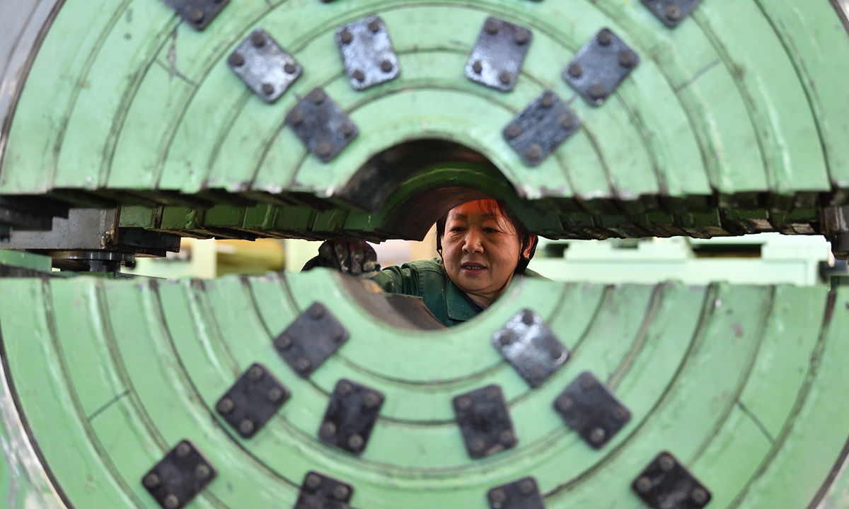 A worker operates machines to produce pipe welding equipment for export at a workshop in Taiyuan, North China's Shanxi Province on February 20, 2025. In 2024, China's total trade of electromechanical products reached 22.1 trillion yuan ($3 trillion), up 8.3 percent year-on-year, with exports surging 8.7 percent year-on-year, official data showed. Photo: VCG