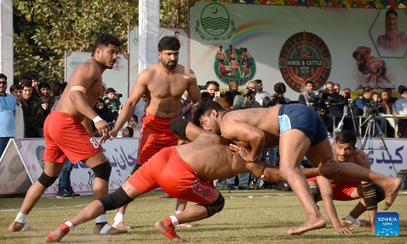 People compete in a Kushti match in Lahore, Pakistan, Feb. 18, 2025. Pehlwani wrestling, also known as Kushti, is a traditional competitive sport which was developed in the Mughal era. It is popular in South Asian countries. (Photo: Xinhua)