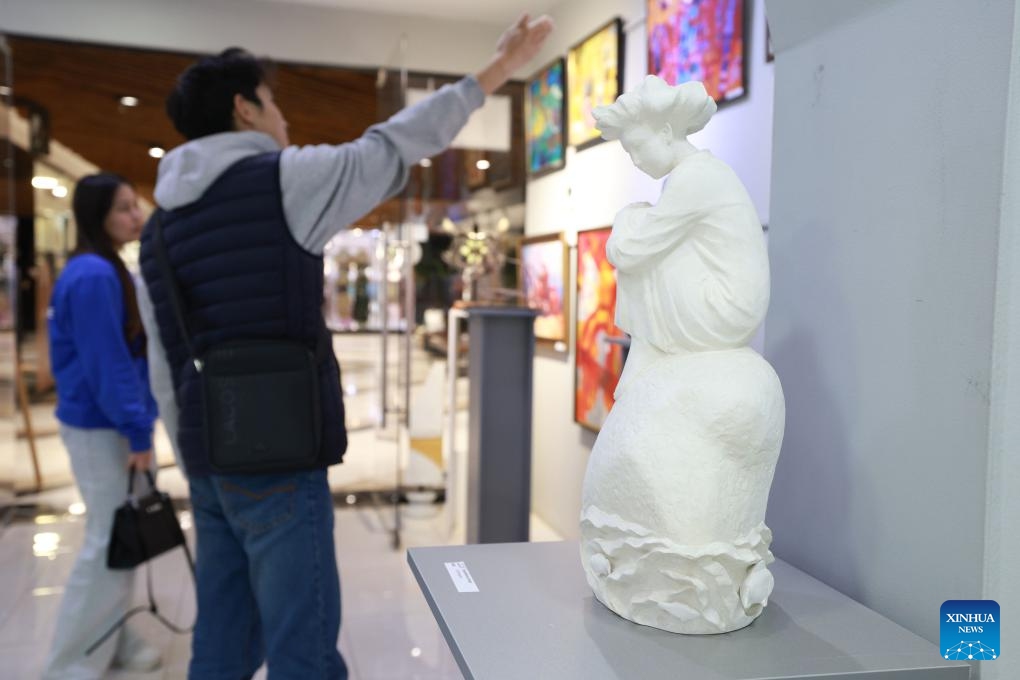 People visit an exhibition of paintings and sculptures about the Silk Road in Bishkek, Kyrgyzstan, on Feb. 18, 2025. The exhibition features more than 60 artworks. (Photo: Xinhua)
