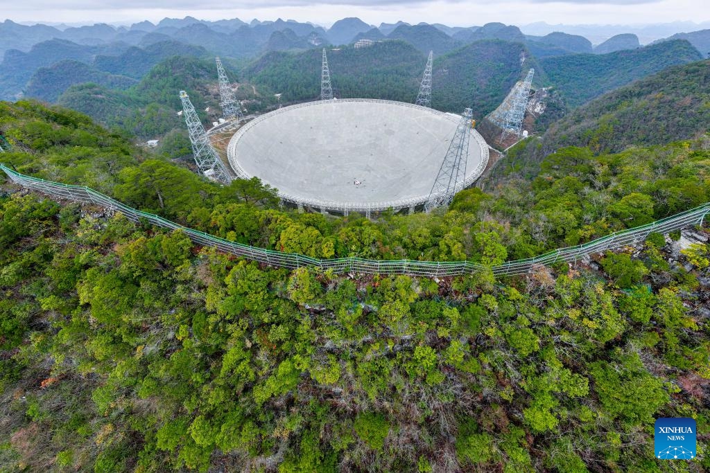 An aerial drone photo taken on Feb. 18, 2025 shows China's Five-hundred-meter Aperture Spherical Radio Telescope (FAST) under maintenance in southwest China's Guizhou Province. In recent years, Guizhou has leveraged its scientific research resources such as FAST to develop educational travel for science, a favorable choice across China for inquisitive minds seeking to embark on a journey of knowledge and exploration in science. (Photo: Xinhua)