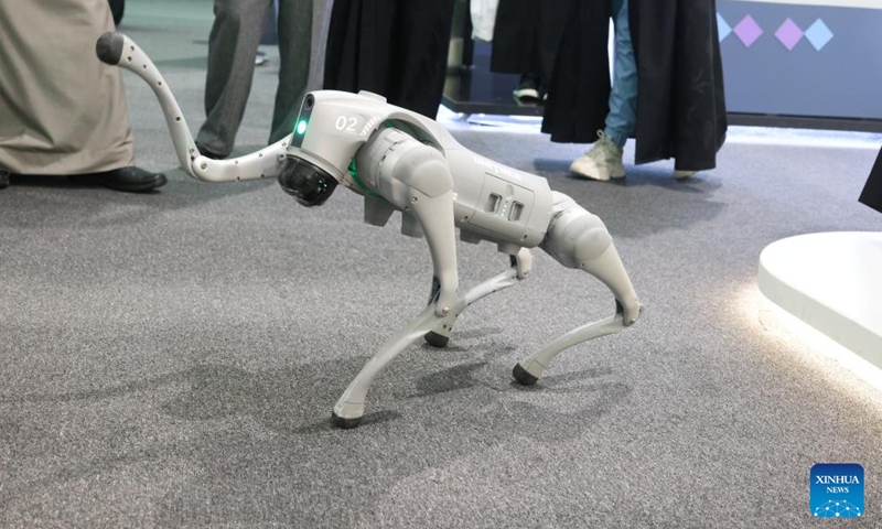 People watch the performance of a robot dog launched by the Chinese company, Unitree Robotics, at the Future of Media Exhibition in Riyadh, Saudi Arabia, on Feb. 20, 2025. A lively crowd frequently erupted into cheers and laughter, as a Chinese robot dog captivated onlookers with its dance moves at the Future of Media Exhibition, which was held alongside the Saudi Media Forum in Riyadh from Wednesday to Friday. (Photo: Xinhua)