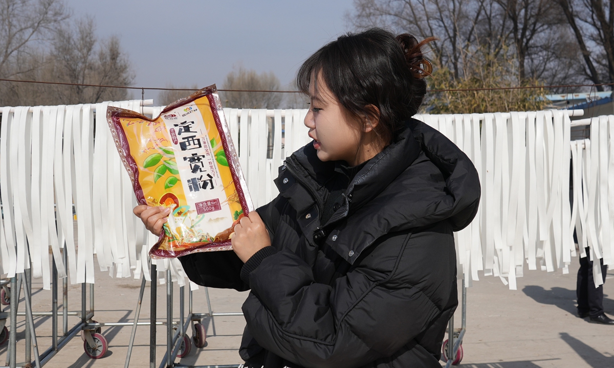 Mao Yanan, deputy secretary of the CPC branch of Yaxia village, Northwest China's Gansu Province, promotes a local agricultural product on livestream. Photo: Courtesy of Mao