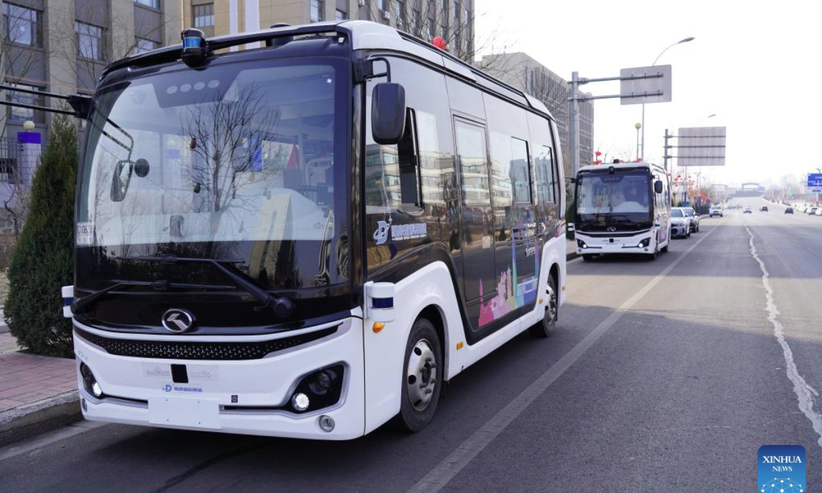 Autonomous driving buses are seen on a street in Yangquan, north China's Shanxi Province, Feb. 27, 2025. (Xinhua/Chen Zhihao)
