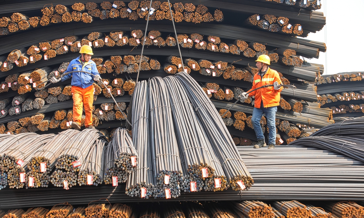 Employees work in the steel logistics area at a warehouse base in Deqing county, East China's Zhejiang Province on February 24, 2025. The proportion of steel used in China's manufacturing industry increased to 50 percent of all steel use in the nation in 2024, up from 42 percent in 2020, with steel demand in the manufacturing sector expected to continue growing in 2025, according to the China Iron and Steel Association. Photo: VCG
