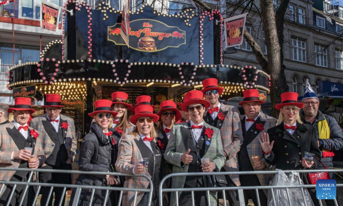 Revelers pose for photos during the Rose Monday carnival parade in Cologne, Germany, March 3, 2025. Rose Monday is the biggest one of its kind held during the annual carnival season in this city of historical heritages. (Xinhua/Zhang Fan)