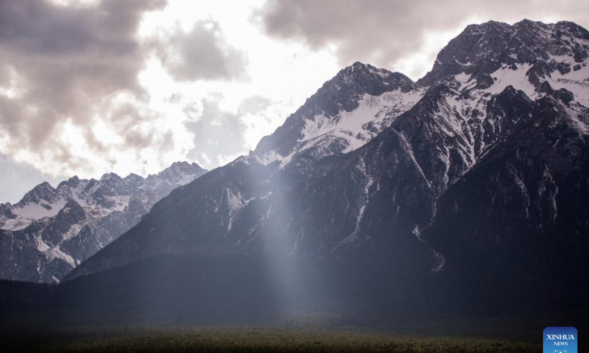 This photo taken on Feb. 25, 2025 shows the scenery of a snow mountain in southwest China's Yunnan Province. A sightseeing train connecting Lijiang ancient town and Yulong Snow Mountain was launched here this February, becoming a new tourism hot spot in northwest Yunnan. (Photo by Peng Yikai/Xinhua)
