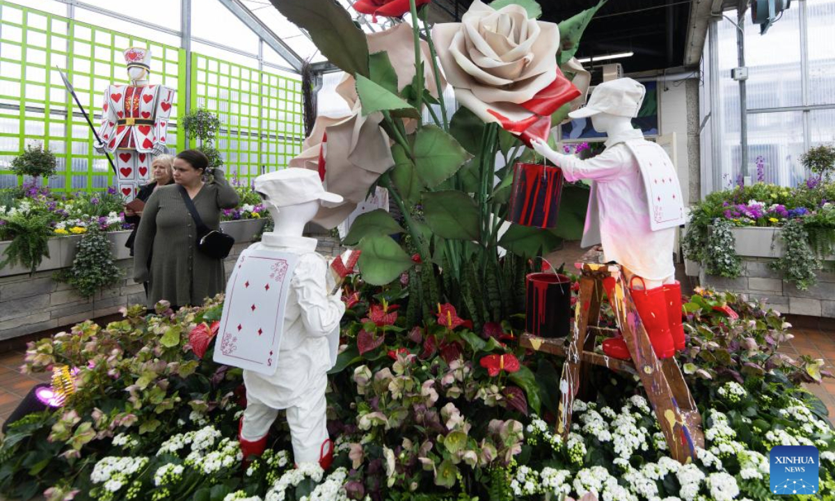 People view a floral installation at the Alice in Bloomland exhibition at the Royal Botanical Gardens in Burlington, Ontario, Canada, on Feb. 26, 2025. Inspired by the pages of Lewis Carroll's Alice's Adventures in Wonderland, the floral exhibition is held here from Feb. 1 to March 30. (Photo by Zou Zheng/Xinhua)