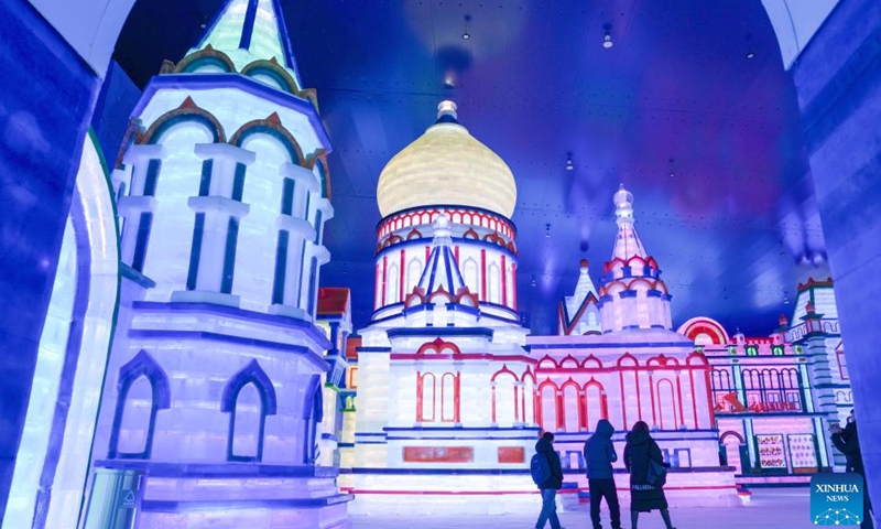 Tourists walk by the ice-and-snow landscapes at an indoor ice-and-snow theme park within Harbin Ice-Snow World in Harbin, northeast China's Heilongjiang Province, Feb. 27, 2025. The world's largest indoor ice-and-snow theme park, a facility located within Harbin Ice-Snow World, reopened on Thursday morning as the outdoor Harbin Ice-Snow World officially closed its 26th edition on Wednesday. Covering an area of 23,000 square meters, the indoor ice-and-snow attraction has seen a comprehensive refurbishment.  (Photo: Xinhua)
