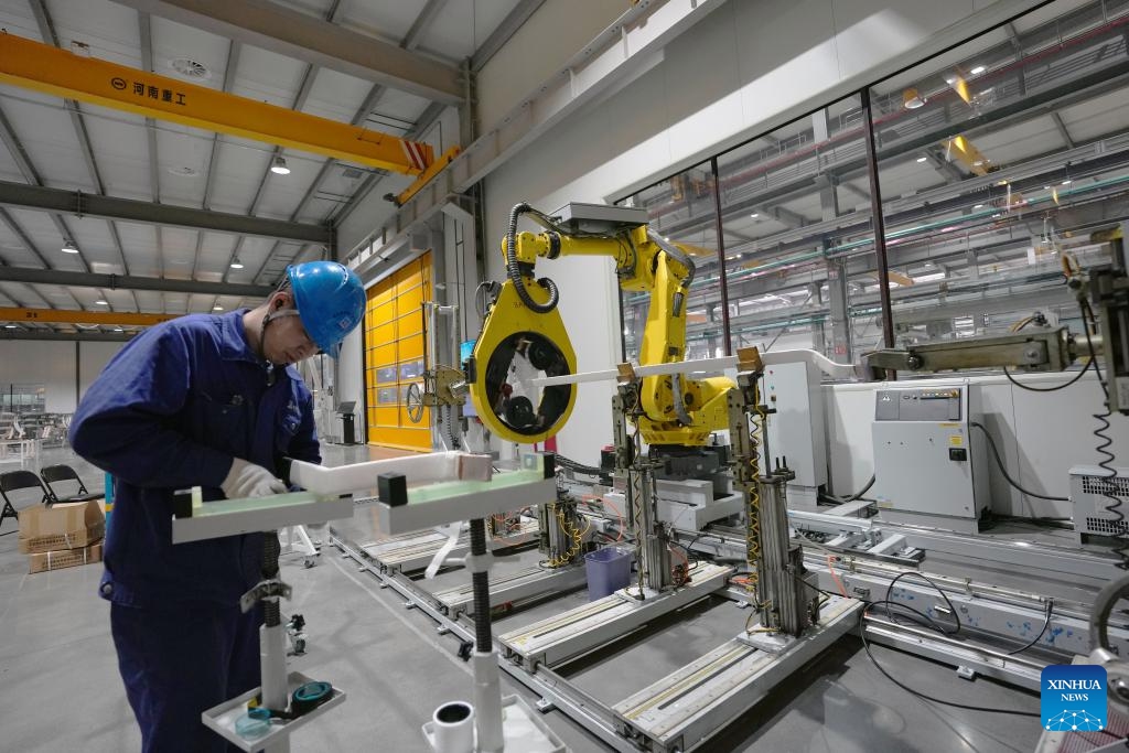A staff member operates with smart equipment at a coil factory in Harbin Electric Machinery Company Ltd. in Harbin, northeast China's Heilongjiang Province, Feb. 26, 2025. As one of the oldest industrial bases of China, Heilongjiang has been leveraging digital intelligence and other advanced technologies to reshape its traditional industrial sectors in recent years. (Photo: Xinhua)