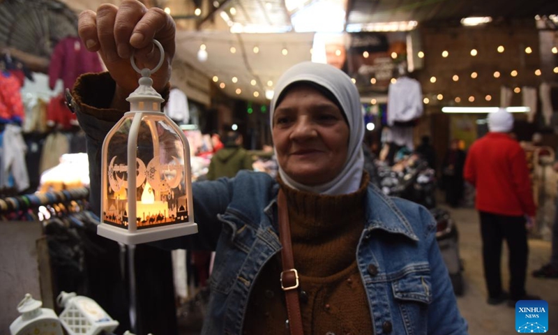 A woman shows a lantern for the upcoming holy month of Ramadan in Tripoli, Lebanon, on Feb. 26, 2025. (Photo: Xinhua)