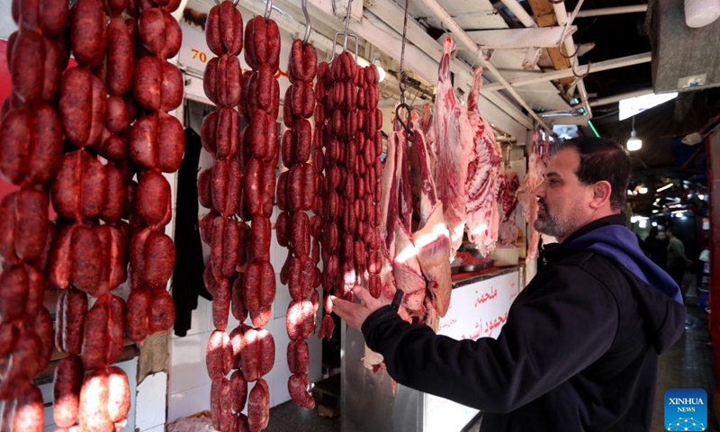 A man buys meat to prepare for Ramadan in Beirut, Lebanon, on Feb. 27, 2025. (Photo: Xinhua)