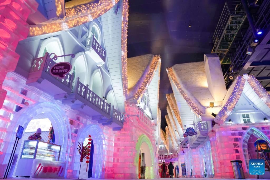 Tourists admire the ice-and-snow sculptures at an indoor ice-and-snow theme park within Harbin Ice-Snow World in Harbin, northeast China's Heilongjiang Province, Feb. 27, 2025. The world's largest indoor ice-and-snow theme park, a facility located within Harbin Ice-Snow World, reopened on Thursday morning as the outdoor Harbin Ice-Snow World officially closed its 26th edition on Wednesday. Covering an area of 23,000 square meters, the indoor ice-and-snow attraction has seen a comprehensive refurbishment. (Photo: Xinhua)