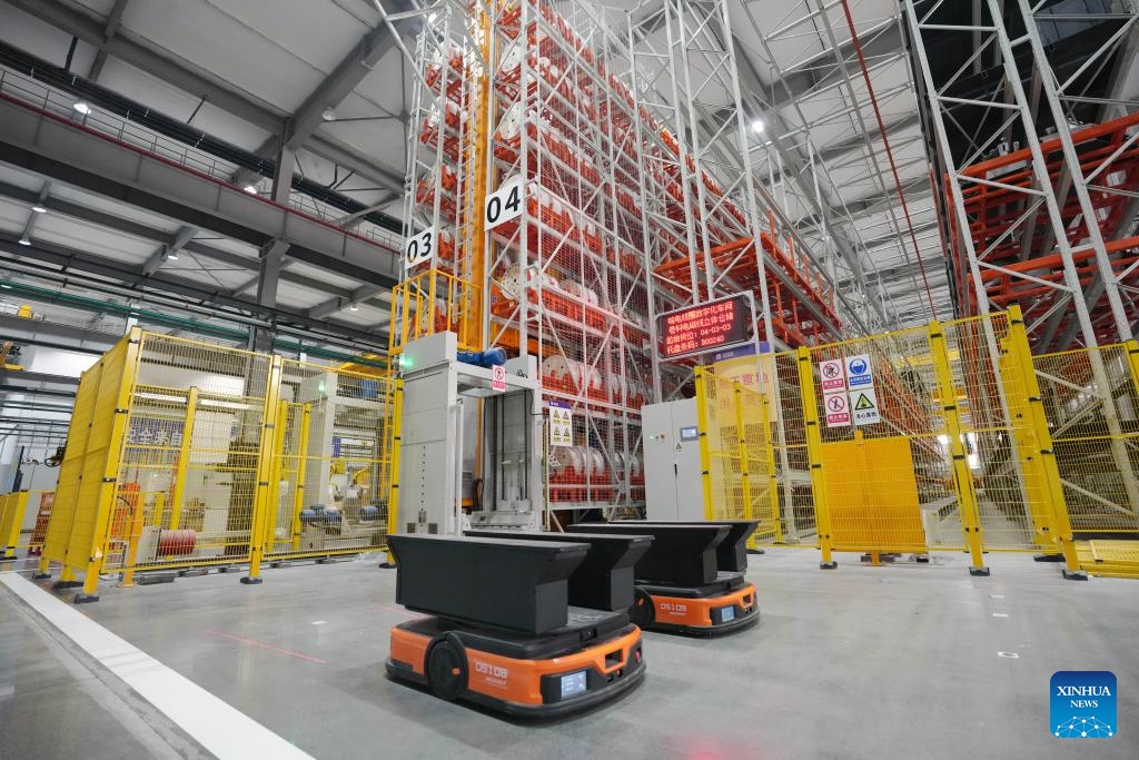 Smart delivery vehicles wait for instructions at a coil factory in Harbin Electric Machinery Company Ltd. in Harbin, northeast China's Heilongjiang Province, Feb. 26, 2025. As one of the oldest industrial bases of China, Heilongjiang has been leveraging digital intelligence and other advanced technologies to reshape its traditional industrial sectors in recent years. (Photo: Xinhua)