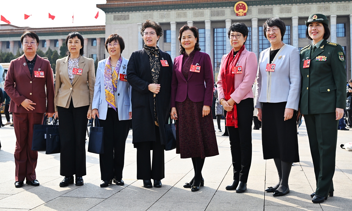 Female members of the Chinese People's Political Consultative Conference (CPPCC) National Committee, China's top political advisory body, pose for a photo in front of the Great Hall of the People on March 4, 2025. The CPPCC National Committee opened its annual session on the day in Beijing. Photo: VCG