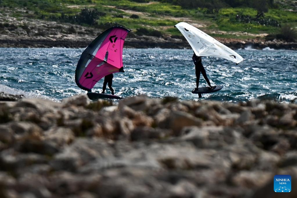 Kitesurfers practise off the Bahar ic-Caghaq coast in Naxxar, Malta, March 6, 2025. (Photo: Xinhua)