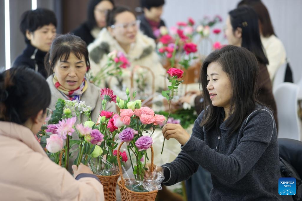 Women learn flower arrangement during an event celebrating the International Women's Day in Huzhou City, east China's Zhejiang Province, March 5, 2025. Various activities are held across the country to mark the International Women's Day. (Photo: Xinhua)