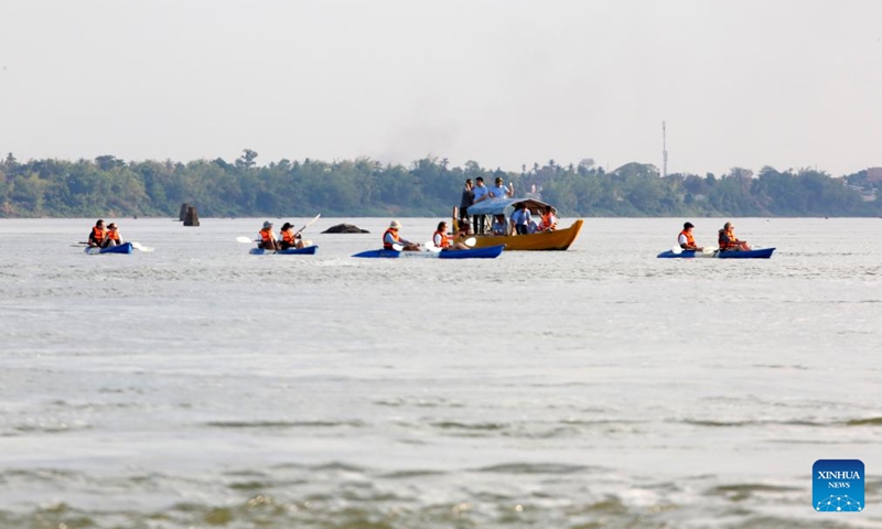 People are on a tour to visit Mekong Irrawaddy dolphins in Kratie province, Cambodia, on March 8, 2025. The Mekong Irrawaddy dolphins have been listed as critically endangered on the International Union for Conservation of Nature (IUCN) Red List of Threatened Species since 2004. Photo: Xinhua