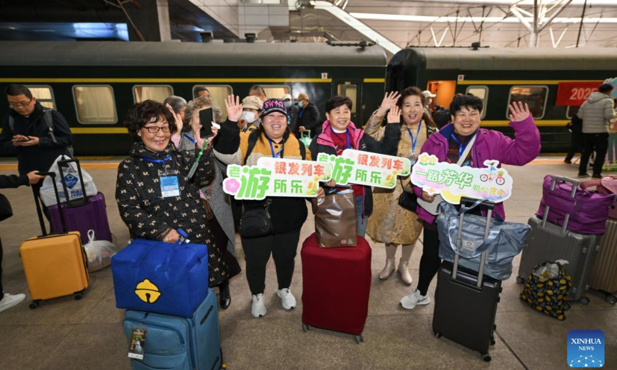 Passengers prepare to board a tourist train for seniors at Tianjin Railway Station in Tianjin, north China, March 15, 2025. A tourist train for seniors departed from north China's Tianjin on Saturday. Carrying a total of 452 silver-haired passengers from the Beijing-Tianjin-Hebei region, the train is on a 12-day journey and will visit a series of tourist areas in Jiangxi, Hunan and Guangdong provinces. (Xinhua/Sun Fanyue)