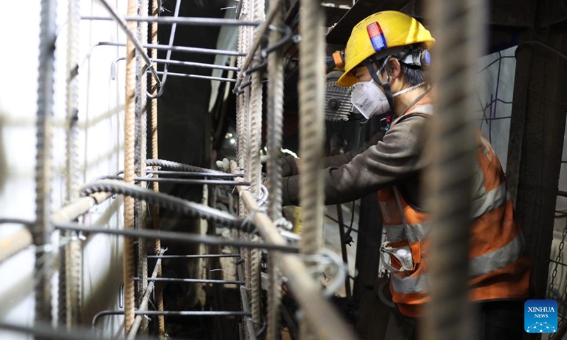 A staff member works on the construction site of the right track tunnel of the Huangjialing Tunnel in Linxia Hui Autonomous Prefecture, northwest China's Gansu Province, March 9, 2025. The right track tunnel of the Huangjialing Tunnel was drilled through on Sunday. The Huangjialing Tunnel, with a total length of 5,881 meters, is a key project of Lanzhou-Hezuo high-speed railway, a part of China's high-speed rail network that centers around eight main vertical lines linking the north and south and eight horizontal lines connecting the east and west. Photo: Xinhua