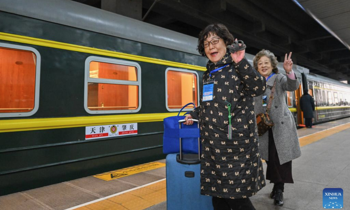 Passengers prepare to board a tourist train for seniors at Tianjin Railway Station in Tianjin, north China, March 15, 2025. A tourist train for seniors departed from north China's Tianjin on Saturday. Carrying a total of 452 silver-haired passengers from the Beijing-Tianjin-Hebei region, the train is on a 12-day journey and will visit a series of tourist areas in Jiangxi, Hunan and Guangdong provinces. (Xinhua/Sun Fanyue)