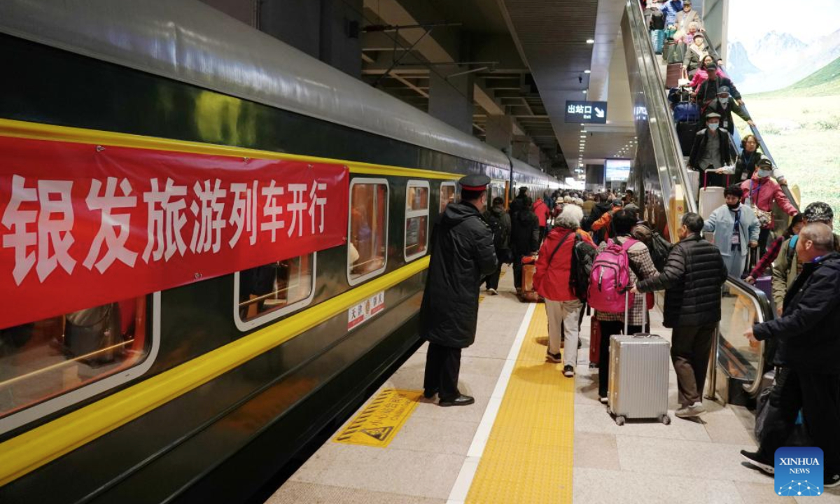 Passengers board a tourist train for seniors at Beijing Fengtai railway station in Beijing, capital of China, March 15, 2025. A tourist train for seniors departed from north China's Tianjin on Saturday. Carrying a total of 452 silver-haired passengers from the Beijing-Tianjin-Hebei region, the train is on a 12-day journey and will visit a series of tourist areas in Jiangxi, Hunan and Guangdong provinces. (Xinhua/Zhang Chenlin)