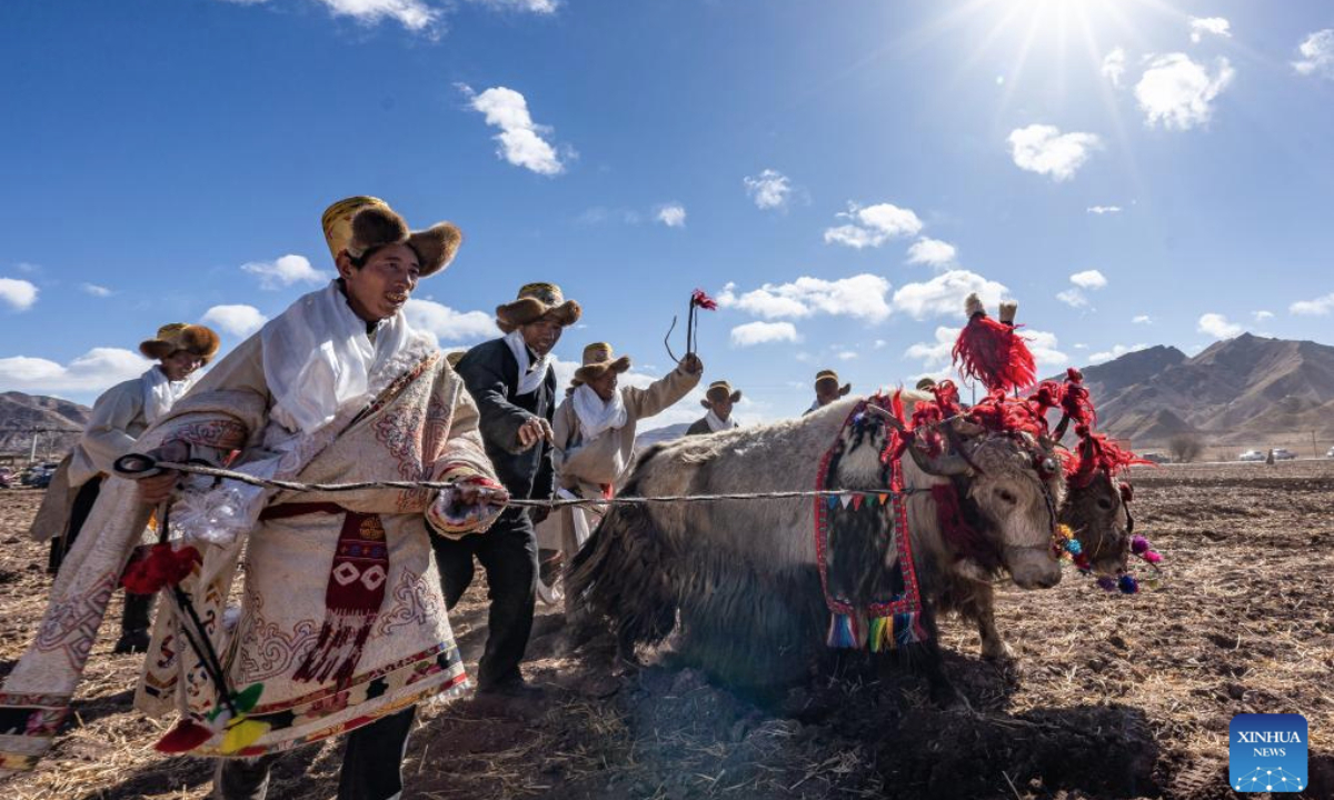 Farmers participate in a ceremony marking the start of spring farming in Codoi Township, Lhunzhub County of Lhasa, southwest China's Xizang Autonomous Region, March 16, 2025. Ceremonies marking the start of spring farming were held across Xizang on Sunday. The ceremony holds great significance as it marks the beginning of a new year's farming season and serves as a prayer for favorable weather and bountiful harvests. It is considered an important ritual in the farming regions of Xizang. (Xinhua/Tenzin Nyida)